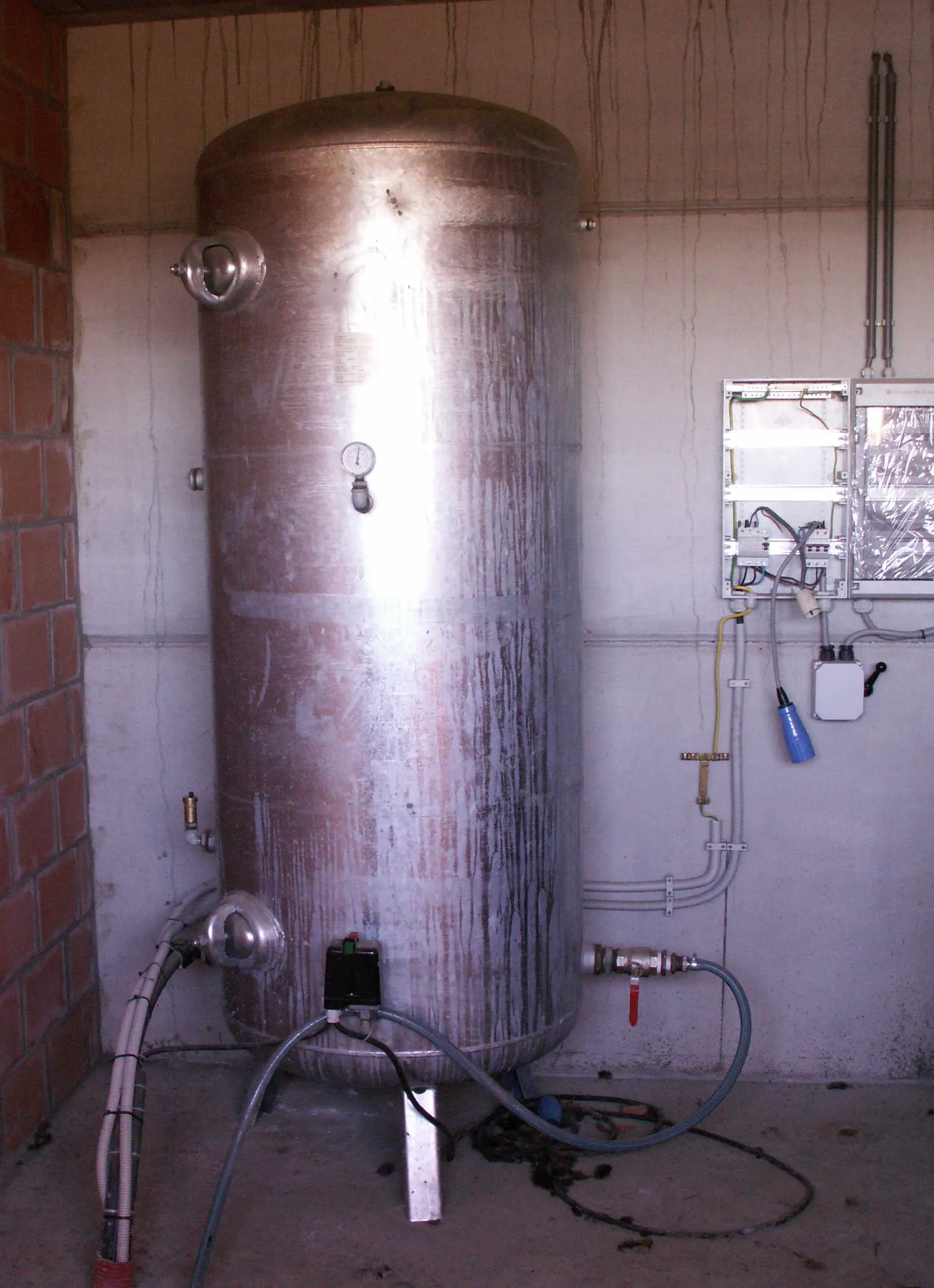Well pressure tank and pump controls being serviced at a Hays County home